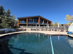 a large swimming pool in front of a building at Timberline Condominiums 3 Bedroom Deluxe Unit D2E in Snowmass Village