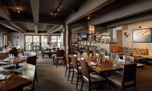 a dining room with wooden tables and chairs at Timberline Condominiums 2 Bedroom plus Loft 3 Bath Deluxe Unit D3D in Snowmass Village