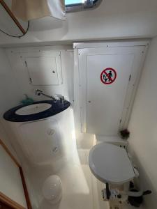 a small bathroom with a toilet and a sink at Dorfe Kotor Muo in Tivat