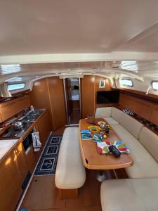 a kitchen and a table in the middle of a boat at Dorfe Kotor Muo in Tivat