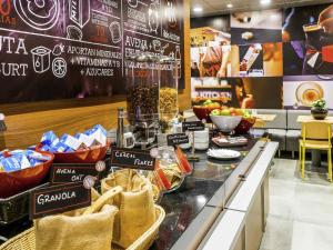 a store with a counter with food on it at ibis Copiapo in Copiapó