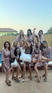a group of women are posing for a picture at Terrace Urla in Urla