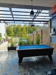 a pool table in the middle of a patio at Mansarda Park View Hotel in Nyagatare