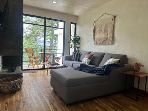 a living room with a couch and a fireplace at Casa Madera Completa in Zacatlán