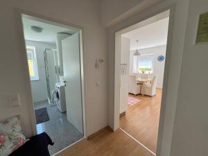 an open door to a room with a living room at Karawanken Nest in Feistritz im Rosental +44 photos