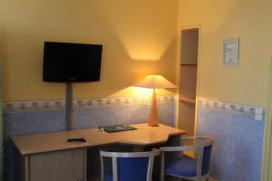 TV a/nebo společenská místnost v ubytování Hotel Des Bains