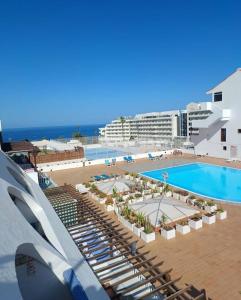 a view of a resort with a pool and a beach at Apartment Parque Royal Costa Adeje in Adeje