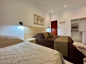 a bedroom with two beds in a room at Hotel Fazenda Chiminelli in Cachoeiras de Macacu +75 photos