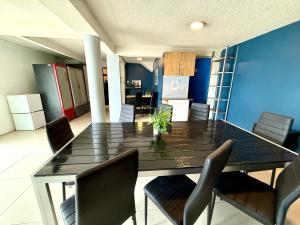 a dining room with a table and chairs at R&A Hostal in Mexico City