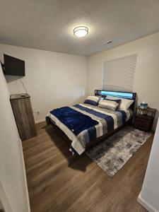 a bedroom with a bed and a television in it at Earl Street Retreat Unit A in Stanfield