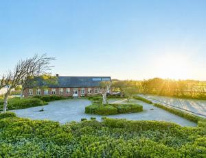 an aerial view of a building with a garden at Lakehouse in Vester Vandet