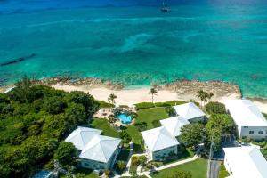 an aerial view of a house on the beach at Cocoplum #3 Condo in George Town +59 photos