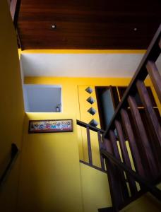 an overhead view of a room with stairs and a painting at Pousada Funny in Morro de São Paulo