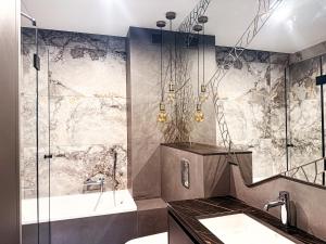 a bathroom with a shower and a sink at FARFA Harmonia Oliwska in Gdańsk