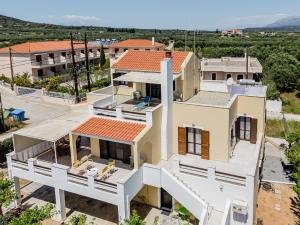 an aerial view of a house under construction at Demie's Maisonette in Plytra with SeaView in Plytra