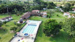 an aerial view of a house with a swimming pool at Villa Beatriz in Palestina