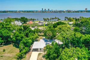 an aerial view of a house next to the water at Heavenly Hideaway in Daytona Beach