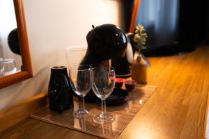 a tray with two wine glasses on a table at Kyyronkaita in Mikkeli +132 photos