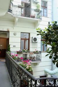 a balcony of a building with flowers on it at Livora Boutique in Budapest