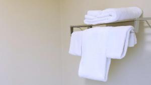 a bathroom with white towels on a towel rack at Keystone Boardwalk Inn and Suites in Keystone