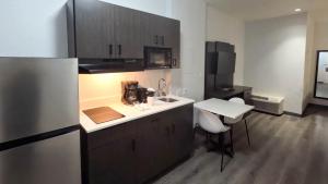 a kitchen with a sink and a counter top at Studio 6-Brownsville, TX in Brownsville