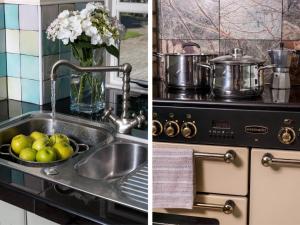 a kitchen sink with a pot and a vase of flowers at 3 Bed in Swansea oc-bn172 in Ystalyfera