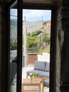 a living room with a couch and a table at Villa Tua in Castanheiro +37 photos