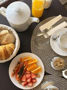 a table with plates of food and a teapot at Villa Tua in Castanheiro