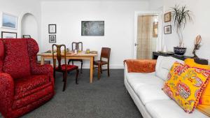 a living room with a couch and a table at Williams Haven in Rothesay