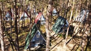 an aerial view of a group of tents in the woods at Abseits vom Alltag, Finnhütte umgeben von Wald und frischer Luft - Fiete in Trassenheide