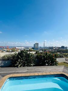 a swimming pool with a view of the city at The Sails-Luxe Penthouse By Ezey Tours in Durban