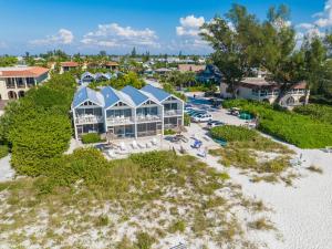 an aerial view of a resort on the beach at Coconuts Beachfront #112 in Holmes Beach
