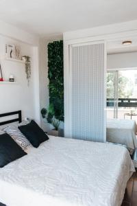 a bedroom with two beds and a window at Home Corinto Beach terraza y piscina - Benalmadena Malaga in Benalmádena +48 photos