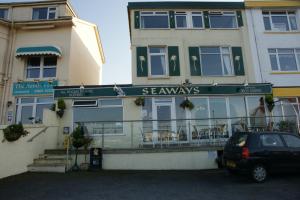 a car parked in front of a restaurant at Seaways in Paignton