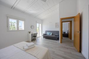 a white room with a bed and a couch at Blue Haven by Fidalsa in Catral +46 photos