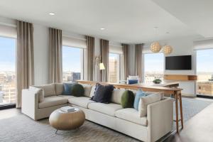 a living room with a couch and some windows at Element by Marriott New Orleans Downtown in New Orleans