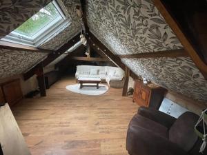 an overhead view of a living room in a attic at Le Breizh des Bois in Le Faouët