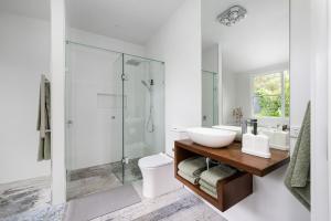 a white bathroom with a sink and a shower at Mysa Homestead in Tonimbuc +57 photos