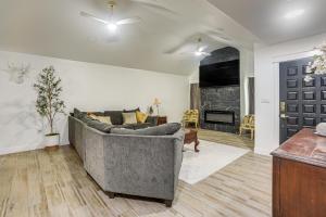 a living room with a couch and a fireplace at Centrally Located Eagle Pass Home w/ Pool! in Eagle Pass