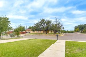 a road with a parking meter in the grass at Centrally Located Eagle Pass Home w/ Pool! in Eagle Pass