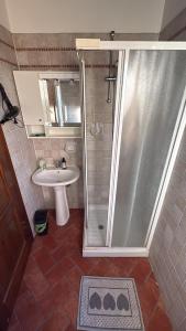 a bathroom with a shower and a sink at Casina Ghiana in Zocca