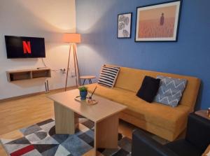 a living room with a couch and a table at Atelier22 in Prilep