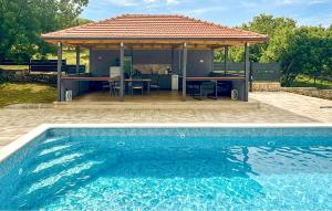a house with a pavilion and a swimming pool at Stunning Home In Sinj in Sinj +20 photos