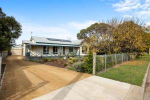 a house with a fence in front of it at Salt & Stay - Laid-Back Comfort by the Beach in Encounter Bay