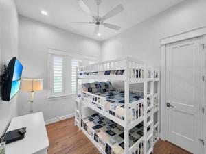 a room with a white shelf with toiletries at Luxury Beachfront Ocean Views Pool Access Sleeps15 in Bolivar Peninsula +47 photos