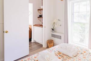 a bedroom with a bed with two pillows on it at Sweet Stowe Apartment in Stowe