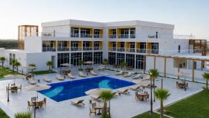 an aerial view of a hotel with a swimming pool at Bosaso Airport Hotel in El Ad