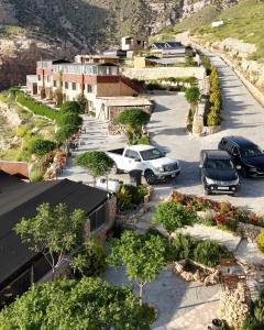 a group of cars parked in a parking lot at Dana Trail Hotel in Dana