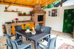 a dining room with a table and chairs at PIK Residence in Mostar
