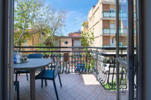 a view of a balcony with a table and chairs at Nida 18 in Cattolica